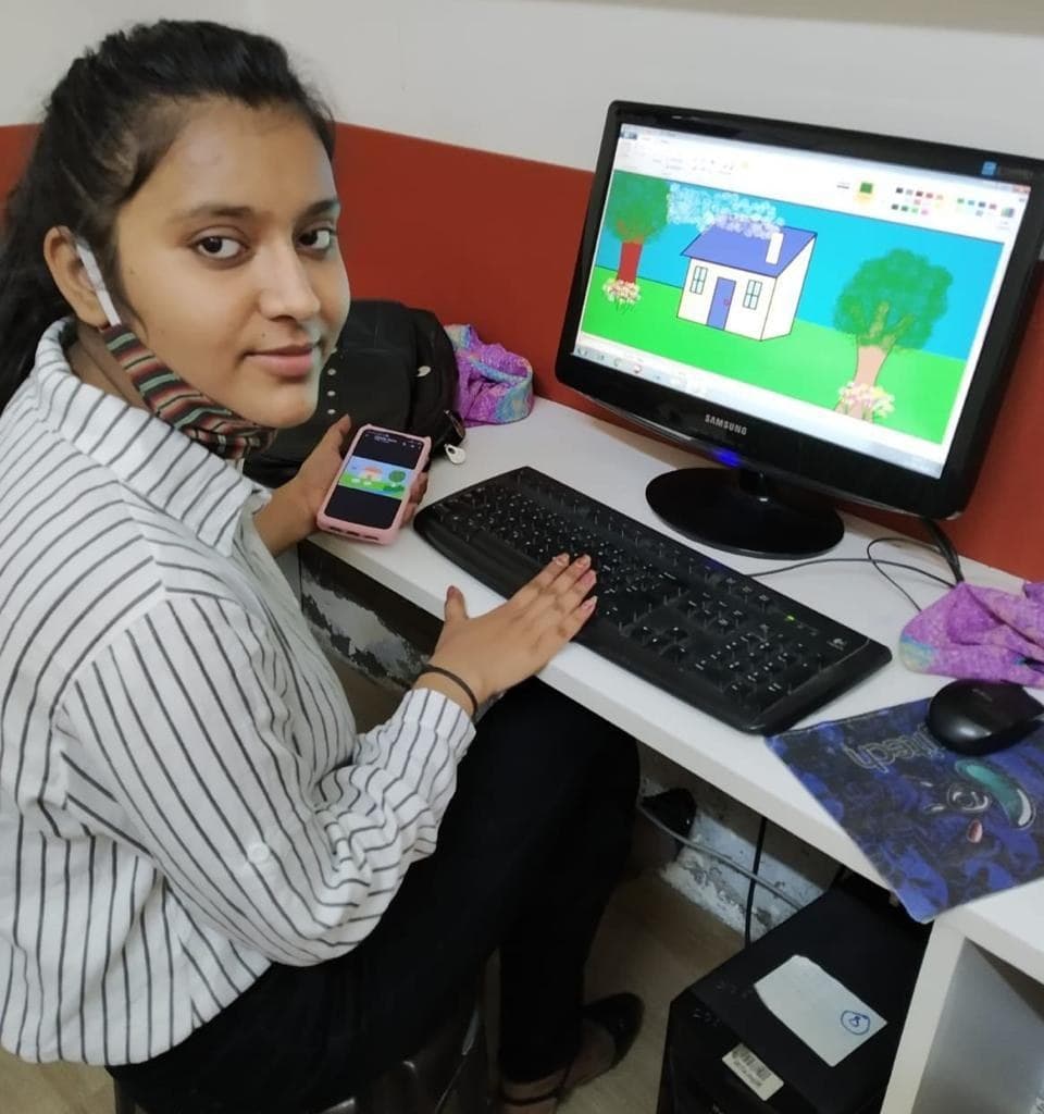 A student at Adarsh Women’s Polytechnic working at a desktop computer in the computing lab.