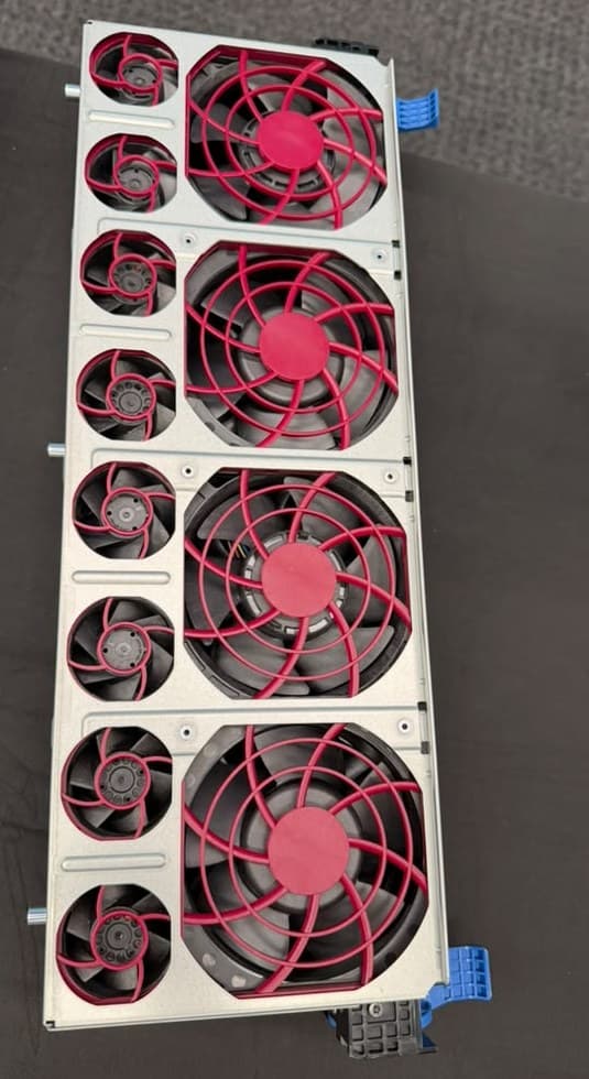 A removable server fan module holding four large fans and eight small ones.